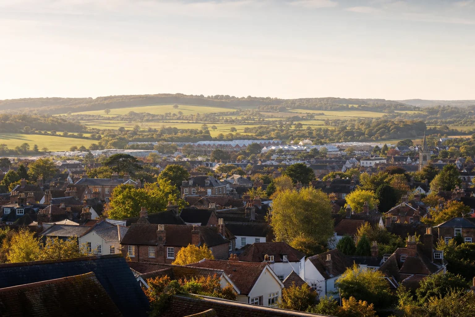 Rolling Kent countryside meeting the rooftops of a market town